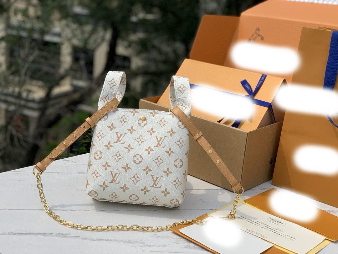 Atlantis BB Monogram Dune Handbags M24408