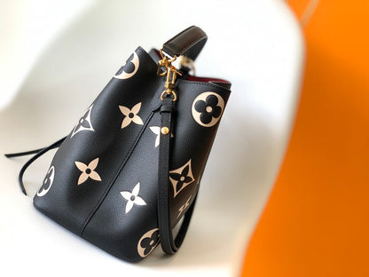 NéoNoé MM Bi-color Monogram Empreinte Leather Medium Bucket Bag M45497