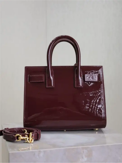 Sac De Jour burgundy patent leather handbag