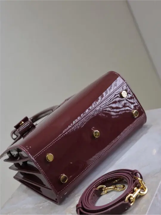 Sac De Jour burgundy patent leather handbag