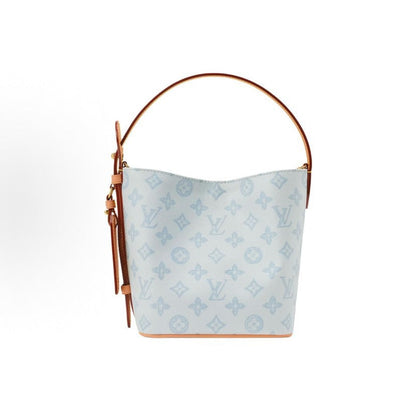 2026 All In BB Bucket Bag in Messenger Blue, crafted from coated canvas with natural cowhide trim M27529