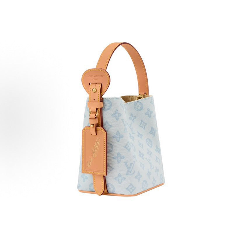 2026 All In BB Bucket Bag in Messenger Blue, crafted from coated canvas with natural cowhide trim M27529