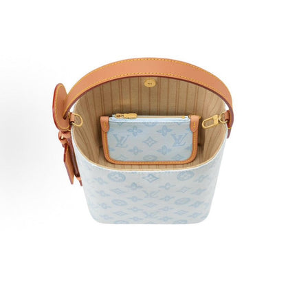 2026 All In BB Bucket Bag in Messenger Blue, crafted from coated canvas with natural cowhide trim M27529